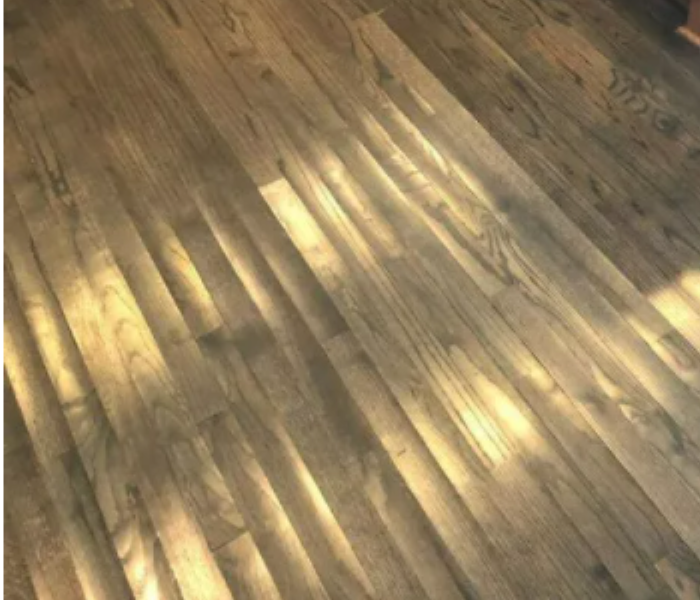 A damaged floor is shown as a result of storms
